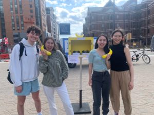 Students posing with bananas